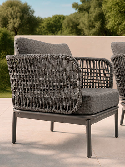 YOLK Anthracite armchair - rear view in an outdoor setting