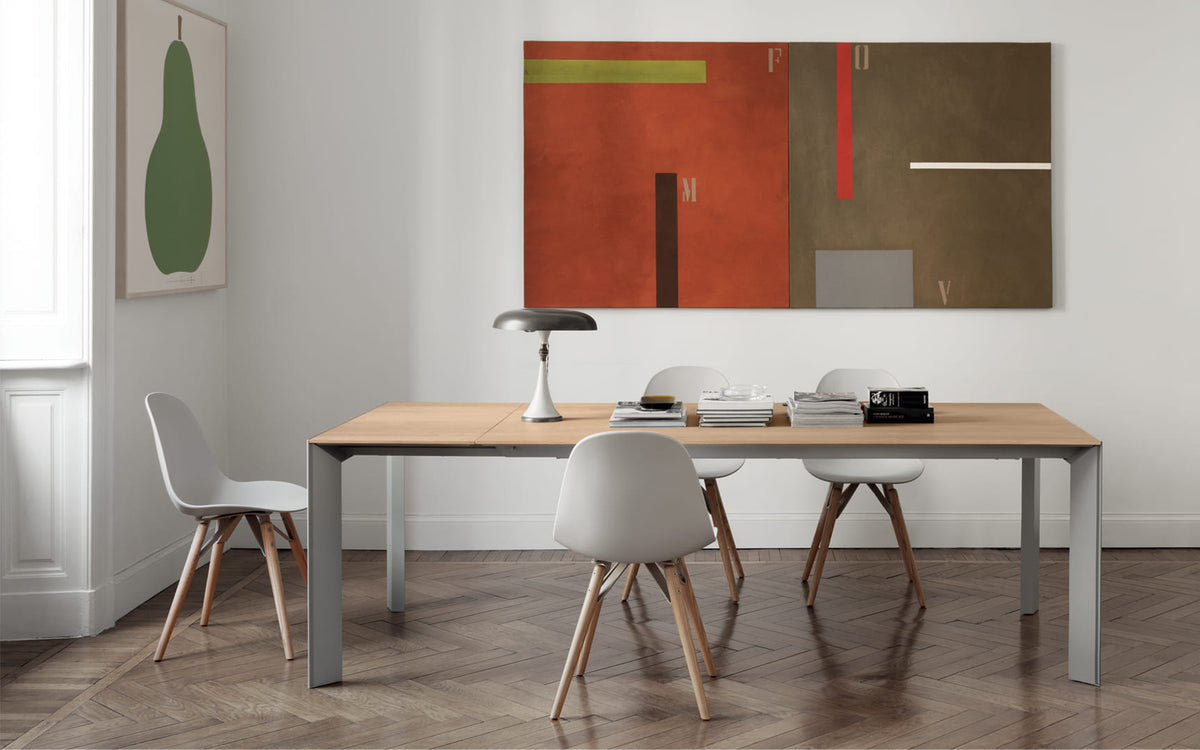 Bontempi Genio Dining Table — manufacturer photograph; GENIO_20-28M097_L009_MOOD_34-08L109_M097_Z006
