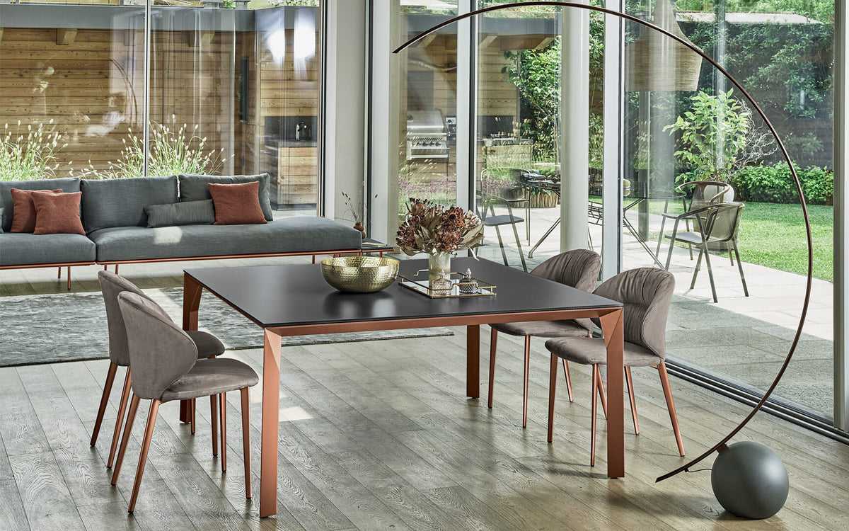 Bontempi Mirage Dining Table — manufacturer photograph; MIRAGE_53-02_M329-C183S-DROP_M329-TN004-CIRCLE_56-33_M028-PC003-DIVANO-DAKOTA_M329-PENNY09