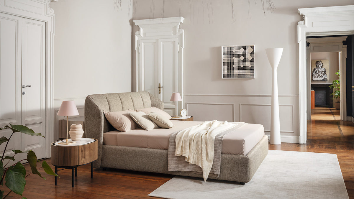 Calligaris Jill bed in an interior. Finish, mattress, bed linen and accessories are illustrative.
