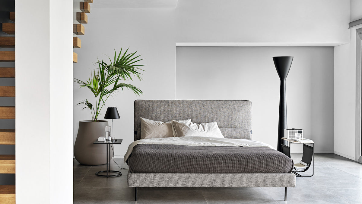 Calligaris Mies bed in an interior. Finish, mattress, bed linen and accessories are illustrative.